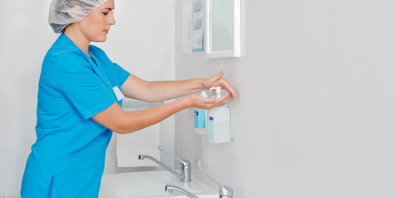 Beautiful nurse wiped his hands dry